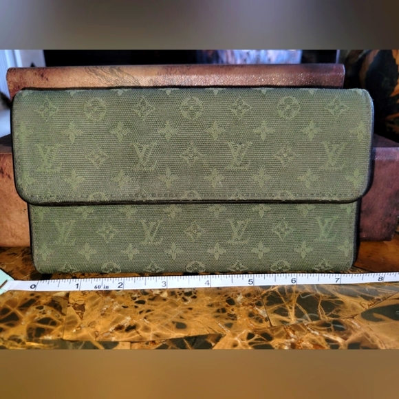 Louis Vuitton mini run porte international - Picture 1 of 11